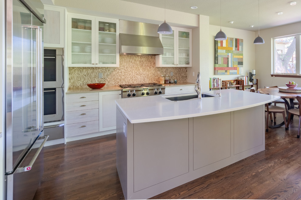 Inspiration for a transitional l-shaped eat-in kitchen remodel in Denver with shaker cabinets and an island
