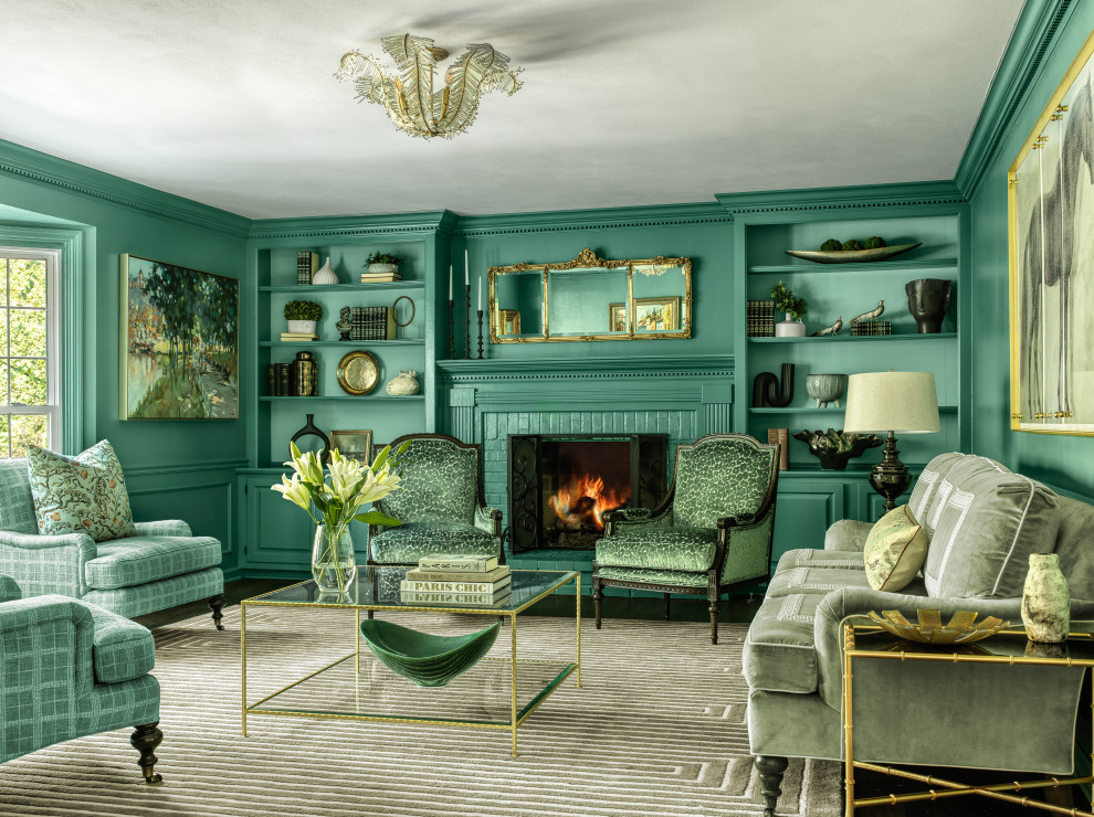 Immagine di un soggiorno chic di medie dimensioni e chiuso con pareti blu, parquet scuro, camino classico e cornice del camino in mattoni
