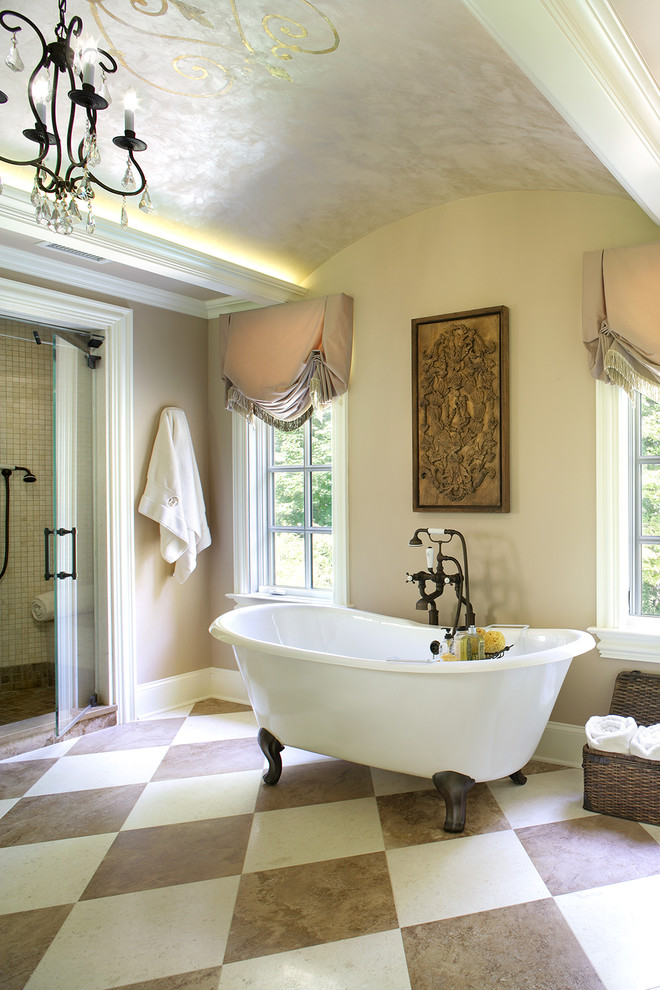 This is an example of a mediterranean bathroom in New York with a freestanding tub, an alcove shower and beige walls.
