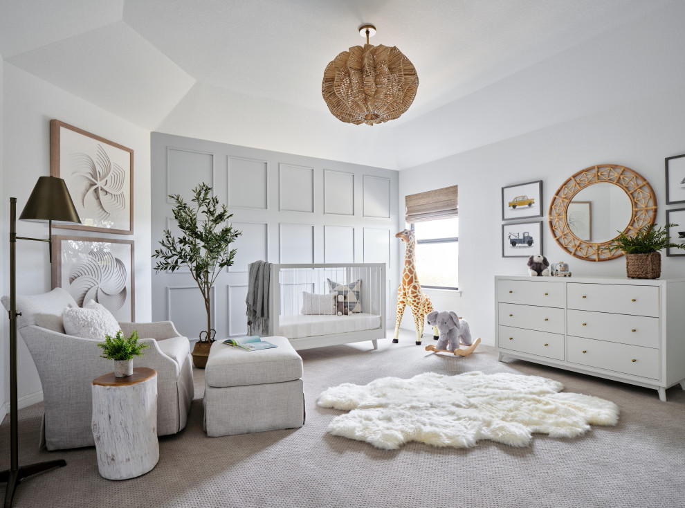 Belterra Project- Furnishings, Light Fixtures & Interior Design - In this the sweet nursery, the designer specified a blue gray paneled wall as the focal point behind the white and acrylic crib.  A comfortable cotton and linen glider and ottoman provide the perfect spot to rock baby to sleep.  A dresser with a changing table topper provides additional function, while adorable car artwork, a woven mirror, and a sheepskin rug add finishing touches and additional texture.