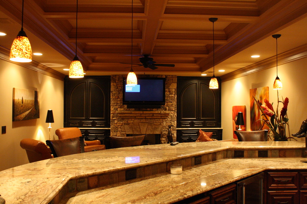 Photo of an expansive traditional walk-out basement in Atlanta with beige walls, dark hardwood floors, a wood stove and a stone fireplace surround.