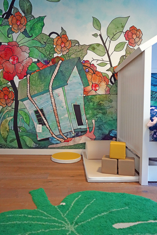 Photo of a small modern children’s room in San Francisco with light hardwood flooring and wallpapered walls.