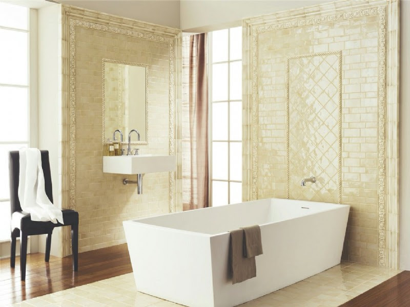 Design ideas for a large traditional master bathroom in Bridgeport with a freestanding tub, beige tile, ceramic tile, medium hardwood floors and a wall-mount sink.