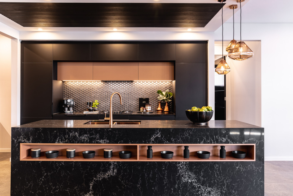 Photo of a contemporary galley kitchen in Sydney with an undermount sink, flat-panel cabinets, black cabinets, black splashback, mosaic tile splashback, with island, grey floor and grey benchtop.