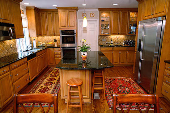 Inspiration for a large kitchen remodel with granite countertops, stainless steel appliances and an island