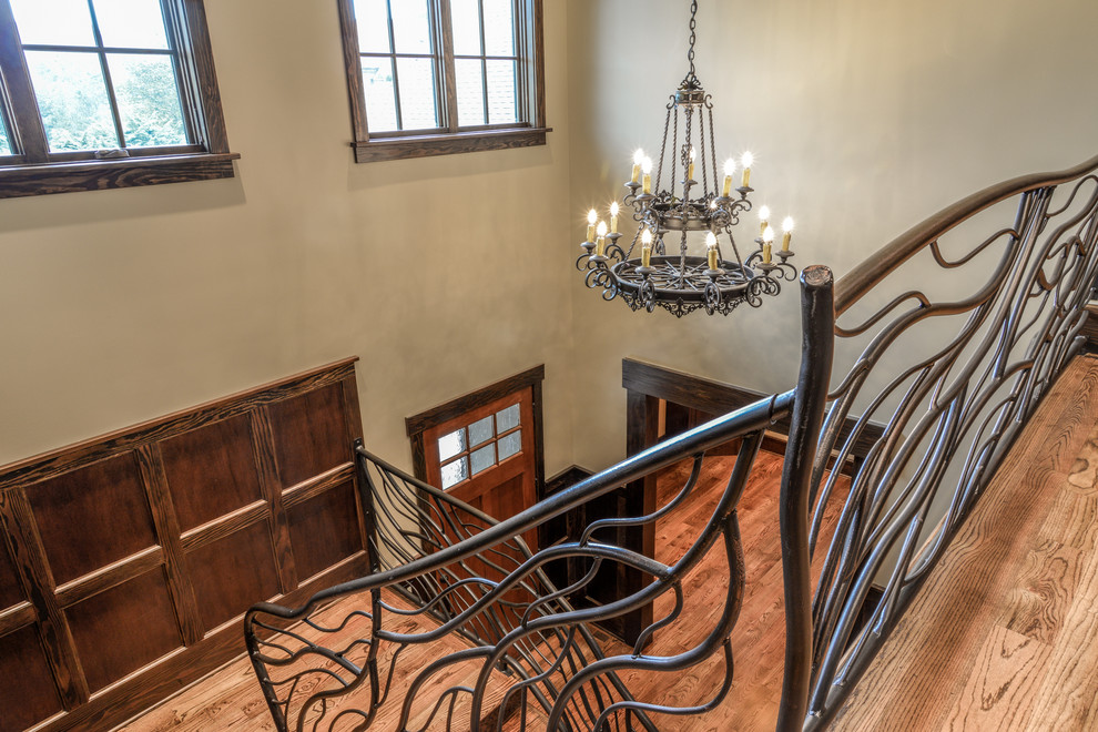Hallway - mid-sized rustic light wood floor and brown floor hallway idea with beige walls