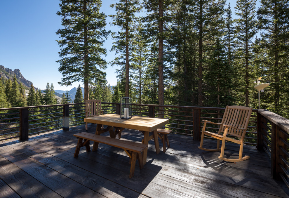 Deck - rustic second story mixed material railing deck idea in Denver with no cover