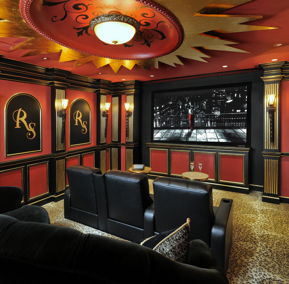 This is an example of a mid-sized traditional home theatre in Houston with red walls, carpet and a wall-mounted tv.