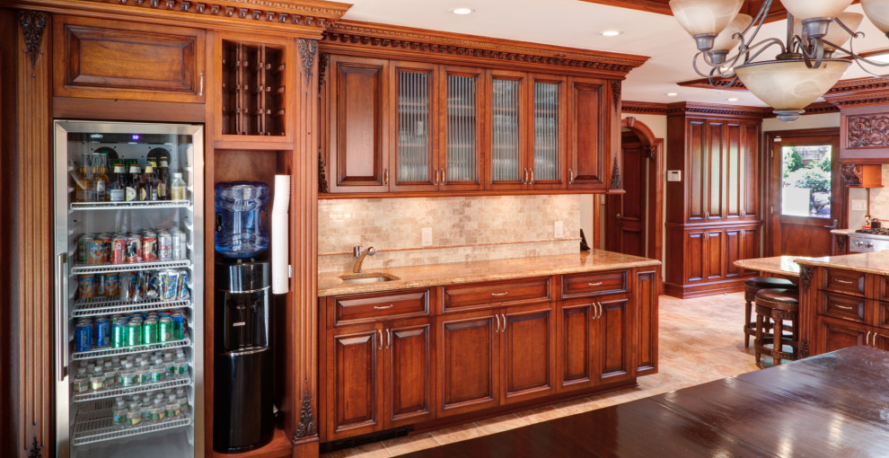 Large traditional u-shaped eat-in kitchen in New York with an integrated sink, shaker cabinets, brown cabinets, quartz benchtops, beige splashback, engineered quartz splashback, stainless steel appliances, with island, beige floor, brown benchtop and coffered.
