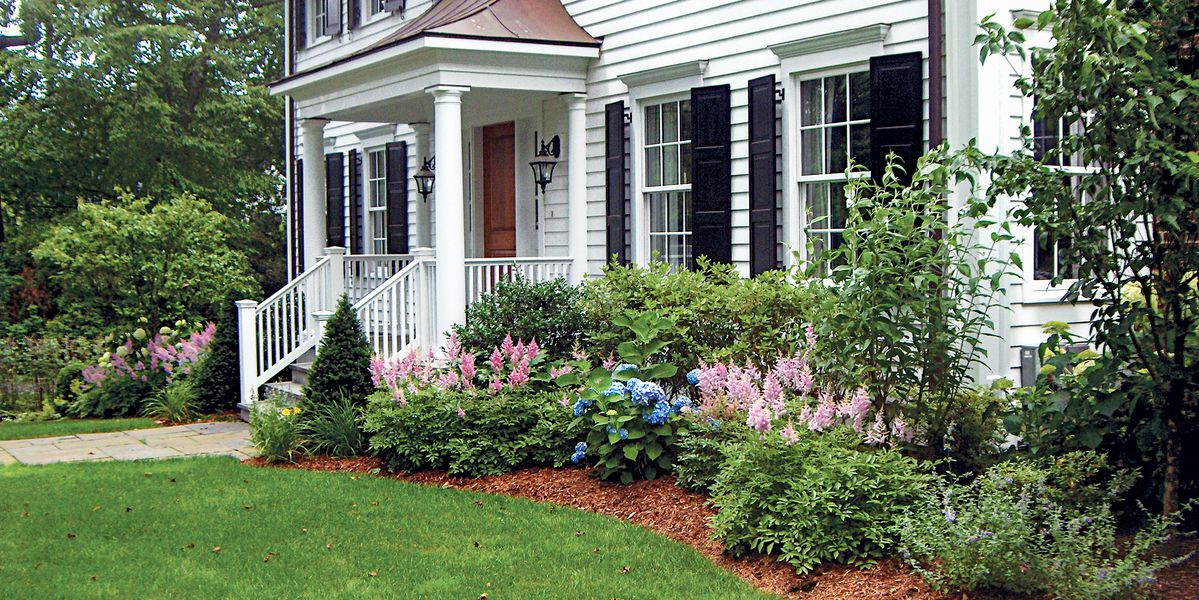 Foundation plantings for this historical home that requested an upgraded setting. Keeping to plants that are traditions we kept the colors warm and with four seasons of color. Peter Atkins and Associa