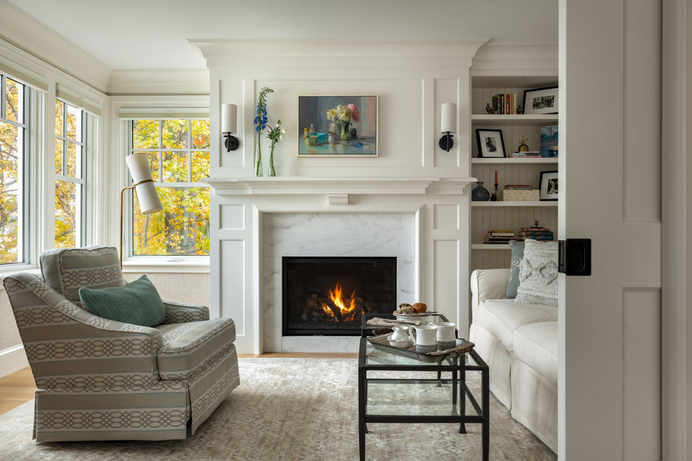 Living room - traditional medium tone wood floor and brown floor living room idea with white walls and a standard fireplace