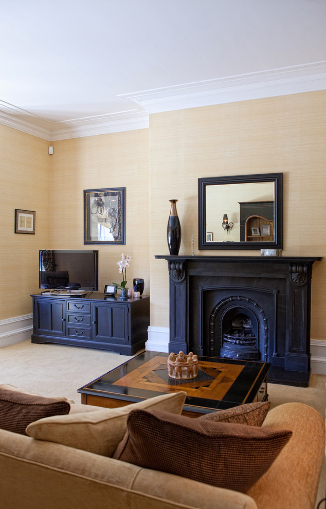 Traditional living room in Other with a stone fireplace surround.