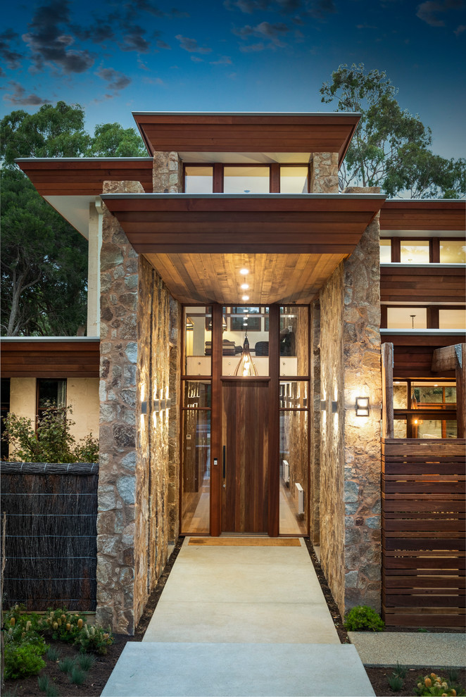 Photo of a large contemporary entryway in Melbourne.