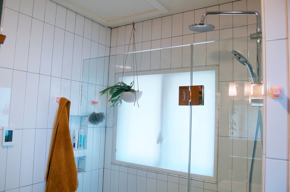 Example of a transitional master white tile ceramic tile and multicolored floor home design design with open cabinets, a two-piece toilet, gray walls, a pedestal sink and a hinged shower door