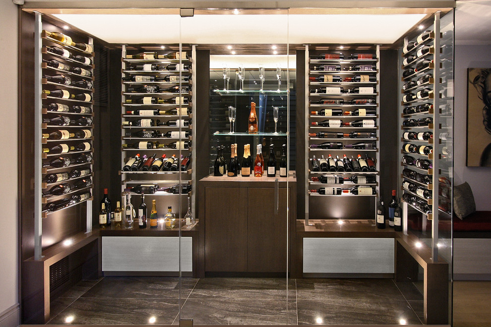 Photo of a mid-sized contemporary wine cellar in Phoenix with display racks, porcelain floors and grey floor.