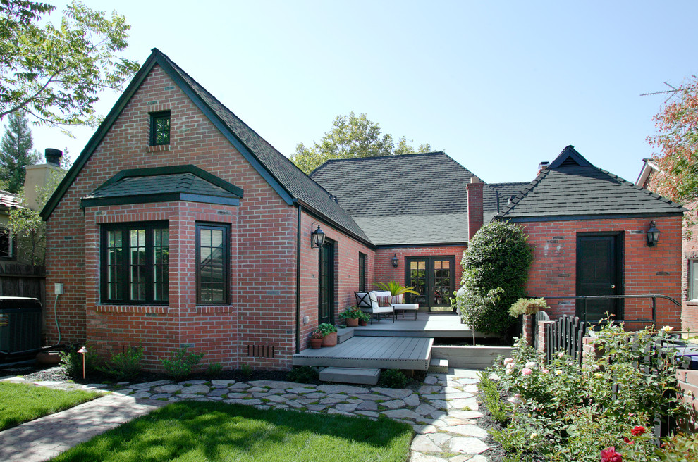 Design ideas for a mid-sized transitional one-storey brick exterior in Sacramento with a gable roof.