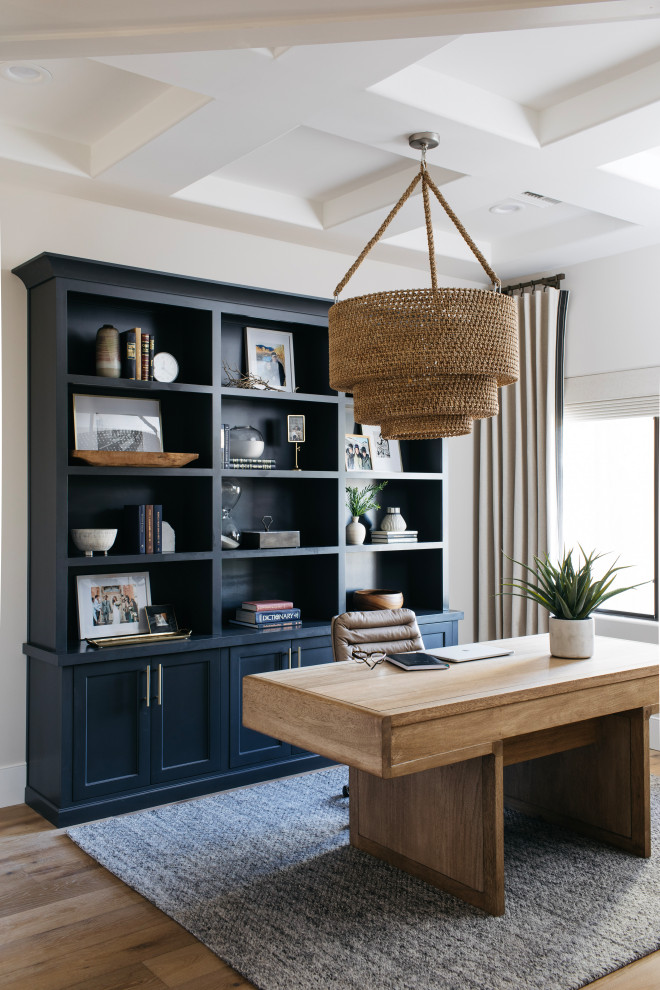 Inspiration for a mid-sized beach style study room in Phoenix with beige walls, medium hardwood floors, a freestanding desk, brown floor and coffered.