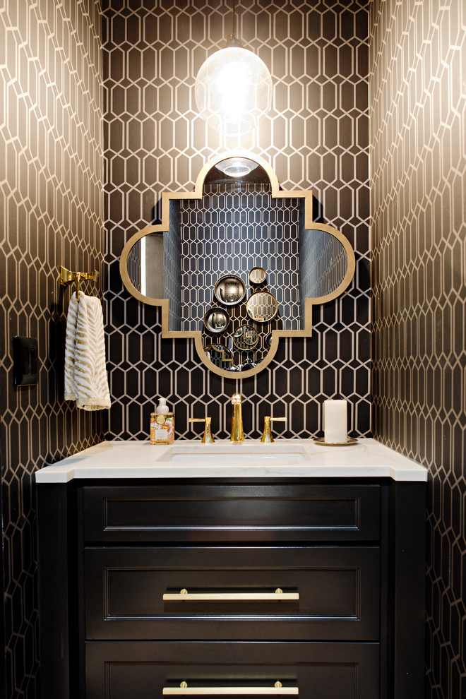 Inspiration for a small transitional powder room in Toronto with recessed-panel cabinets, black cabinets, an undermount sink, marble benchtops, brown walls and white benchtops.