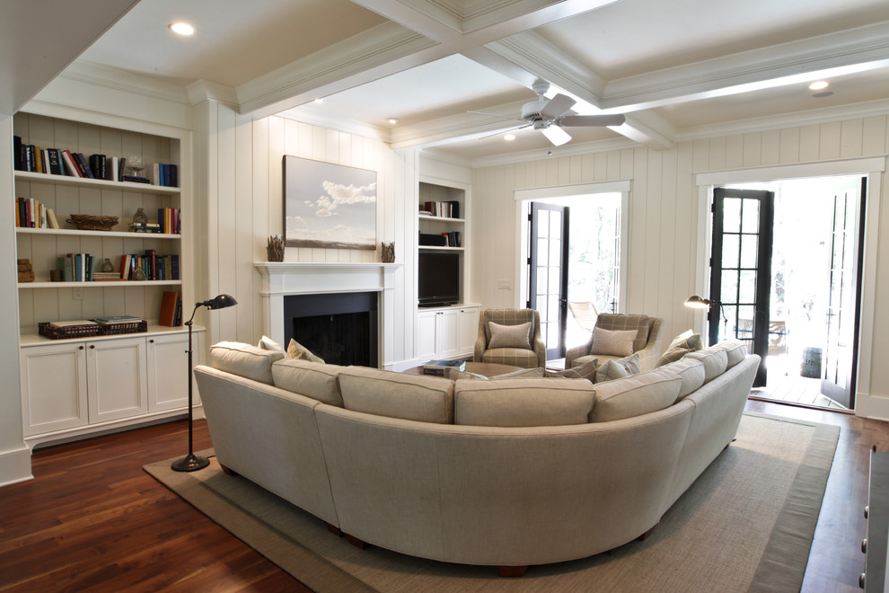 Design ideas for a beach style living room in Charleston with a standard fireplace.