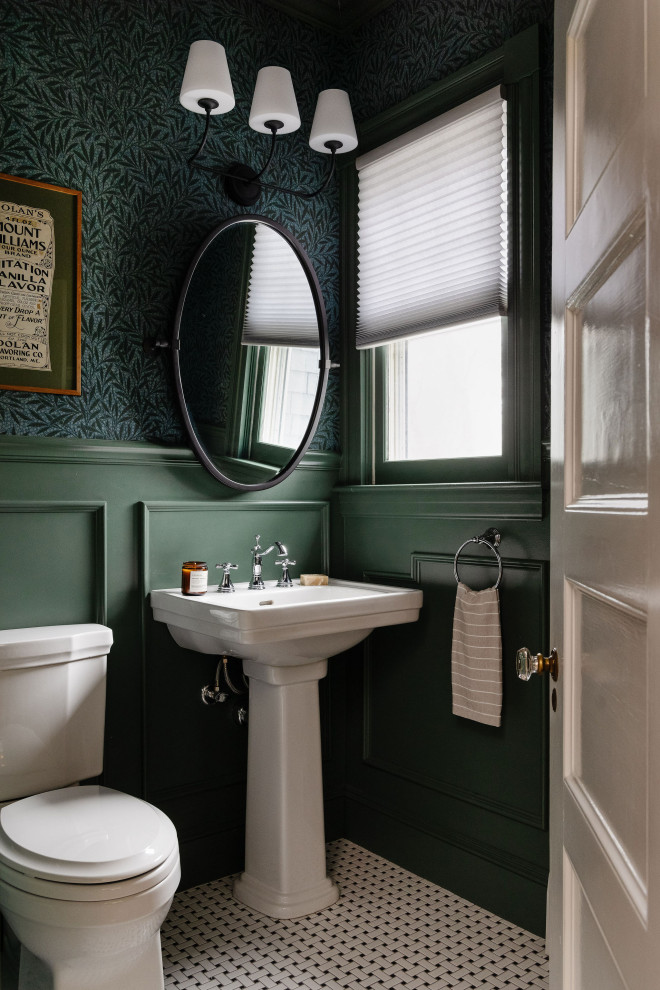 Example of an ornate multicolored floor and wallpaper powder room design in Boston with a two-piece toilet, green walls, a pedestal sink and a freestanding vanity