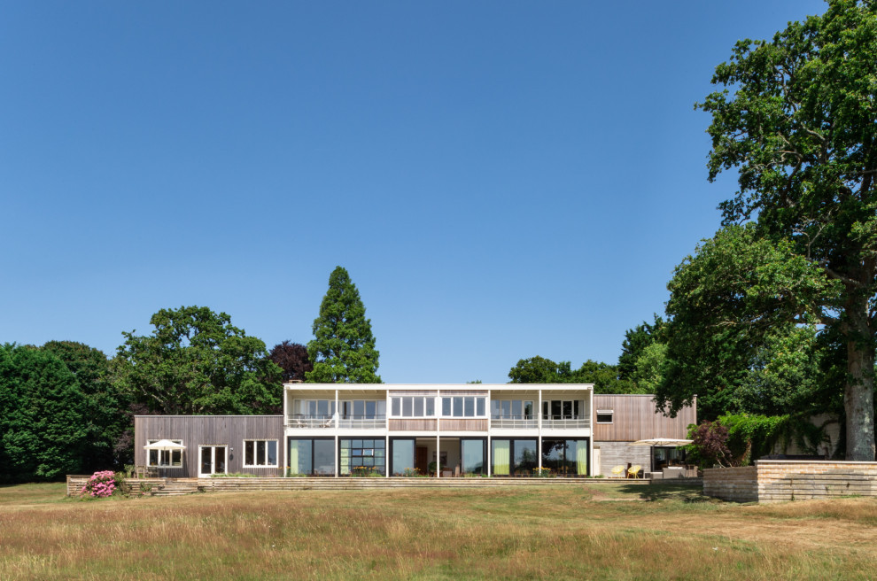 This is an example of a large contemporary house exterior in Sussex.