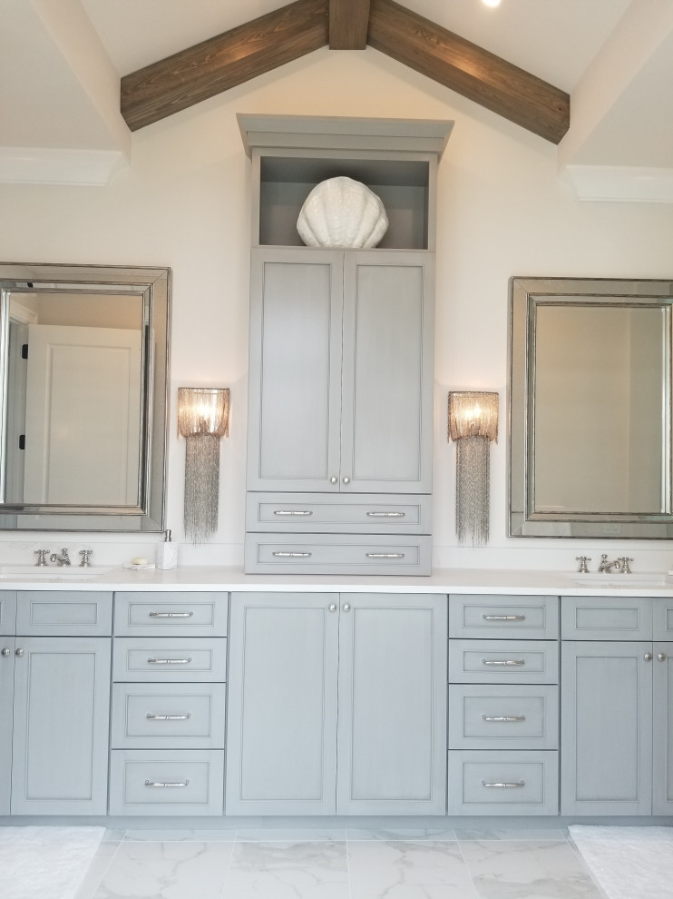 Freestanding bathtub - large transitional master gray tile and porcelain tile porcelain tile and gray floor freestanding bathtub idea in Miami with beaded inset cabinets, gray cabinets, a two-piece toilet, beige walls, an undermount sink, quartz countertops and gray countertops