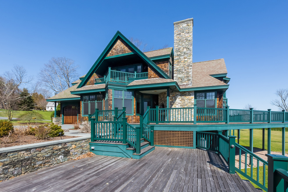 Example of a huge arts and crafts side yard deck design in Providence with no cover