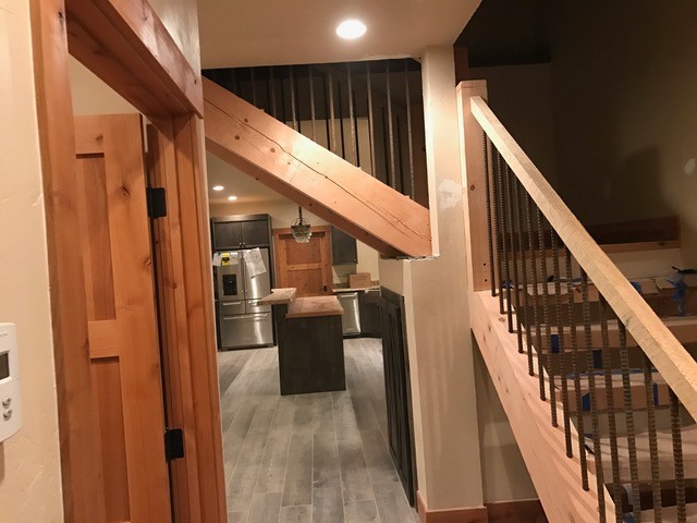 Staircase - mid-sized rustic l-shaped open and mixed material railing staircase idea in Denver
