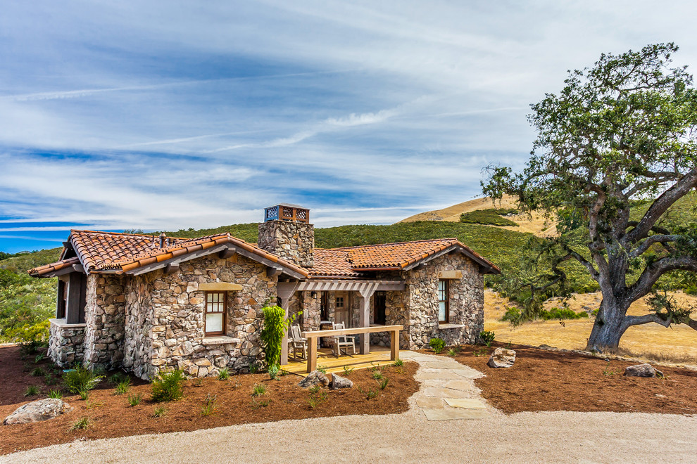 Photo of a mid-sized country one-storey exterior in San Francisco with stone veneer.