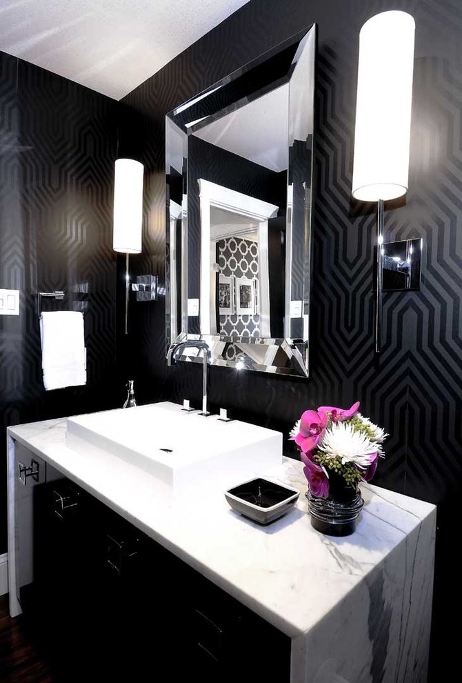 This is an example of a contemporary bathroom in Other with a vessel sink and black walls.