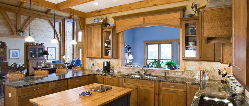 Inspiration for a large rustic u-shaped medium tone wood floor eat-in kitchen remodel with a drop-in sink, dark wood cabinets, marble countertops, beige backsplash, ceramic backsplash, stainless steel appliances and an island