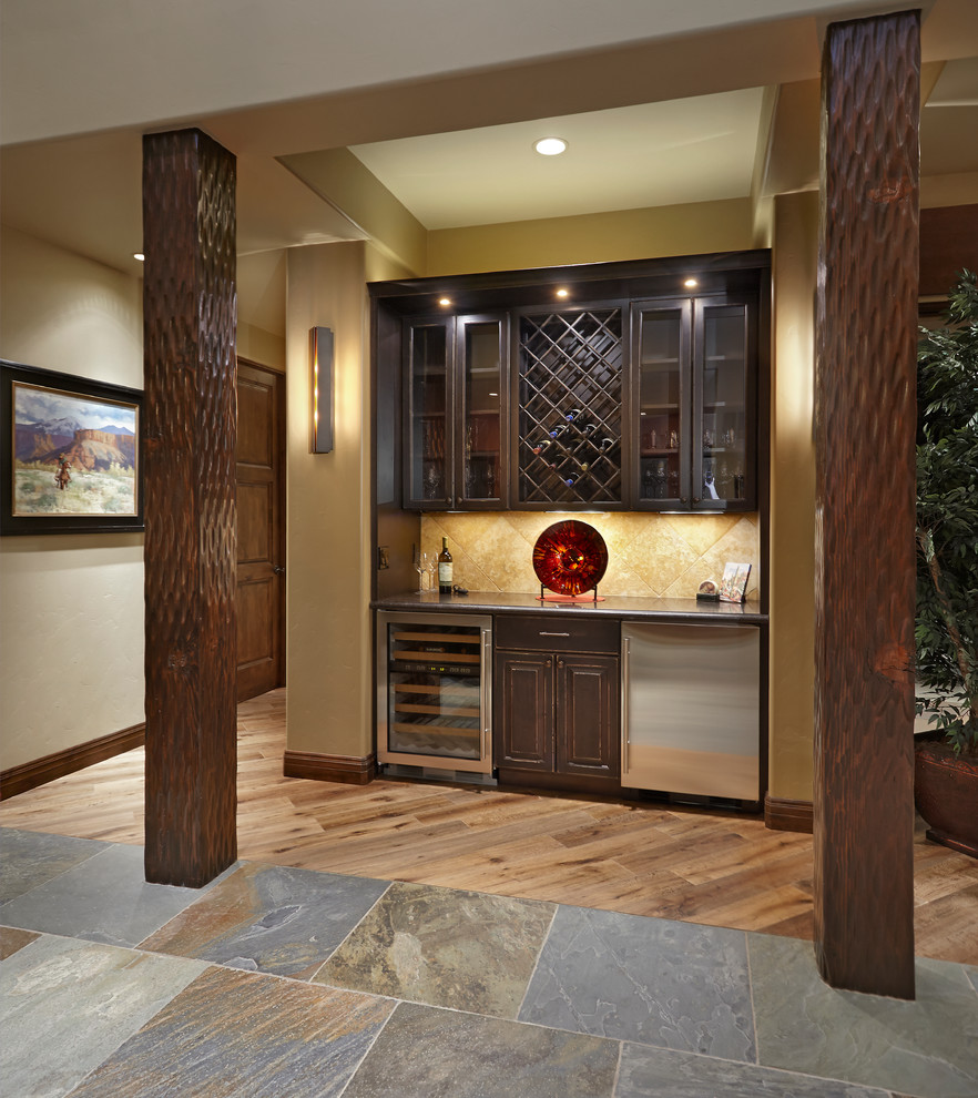Design ideas for a wine cellar in Phoenix with medium hardwood floors and diamond bins.
