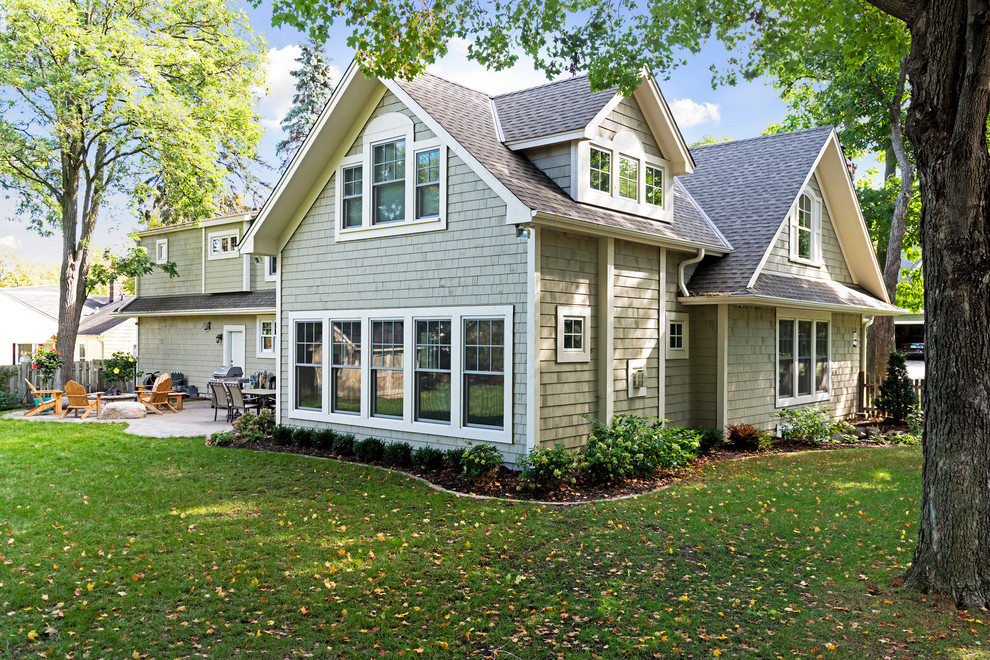 Large cottage chic gray two-story wood gable roof photo in Minneapolis