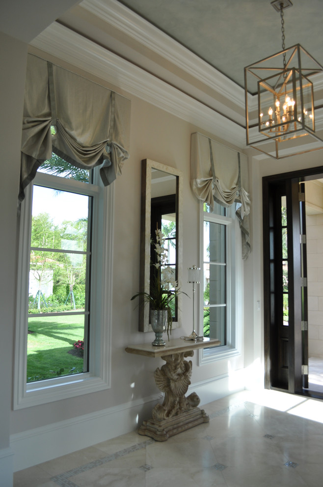Photo of a transitional entryway in Miami.