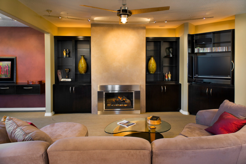 Inspiration for a mid-sized contemporary open concept family room in Boise with carpet, a standard fireplace, a metal fireplace surround, a concealed tv and yellow walls.