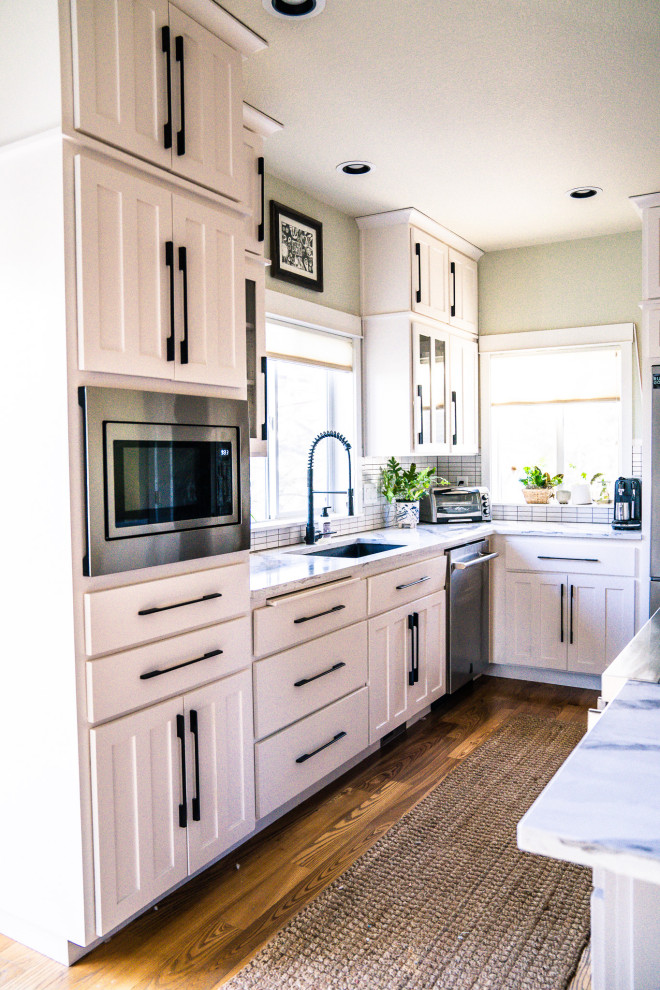 Example of a transitional kitchen design in Denver