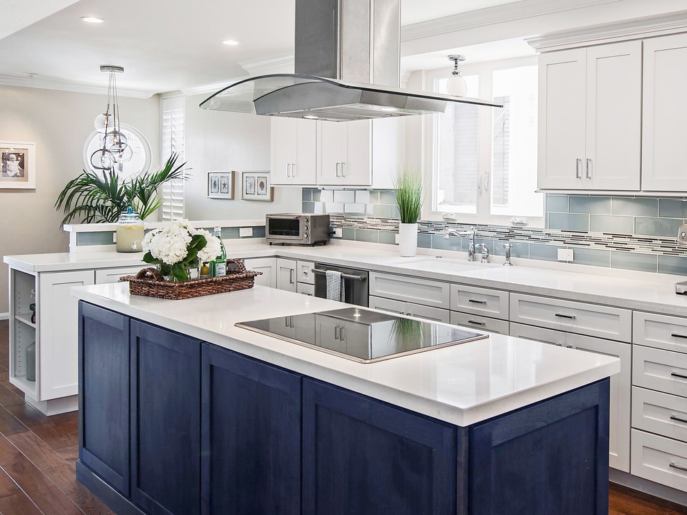 Inspiration for a transitional eat-in kitchen remodel in Seattle with shaker cabinets, quartz countertops and glass tile backsplash