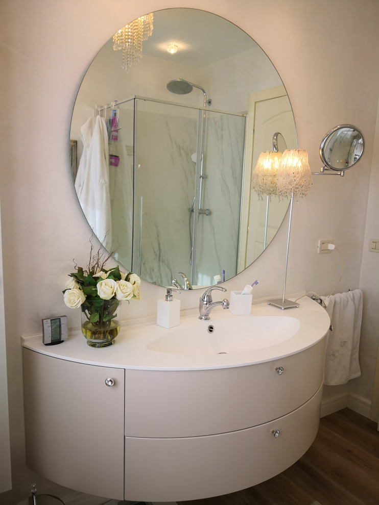 Example of a mid-sized trendy 3/4 vinyl floor, single-sink and tray ceiling walk-in shower design in Other with flat-panel cabinets, beige cabinets, an integrated sink, quartzite countertops, a hinged shower door, white countertops and a floating vanity