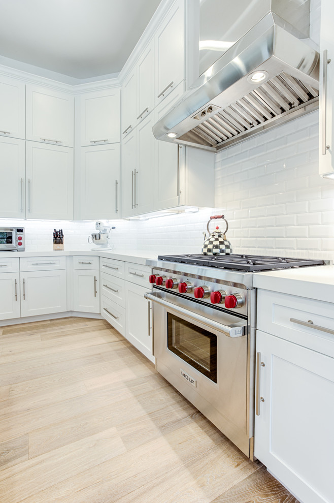Open concept kitchen - large transitional galley open concept kitchen idea in Phoenix with shaker cabinets and an island