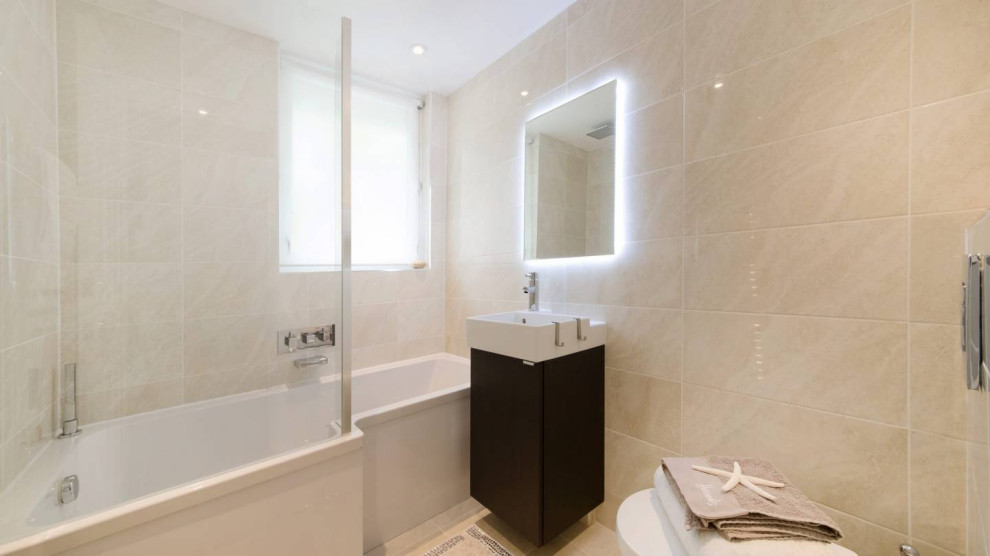 This is an example of a medium sized contemporary ensuite bathroom in London.