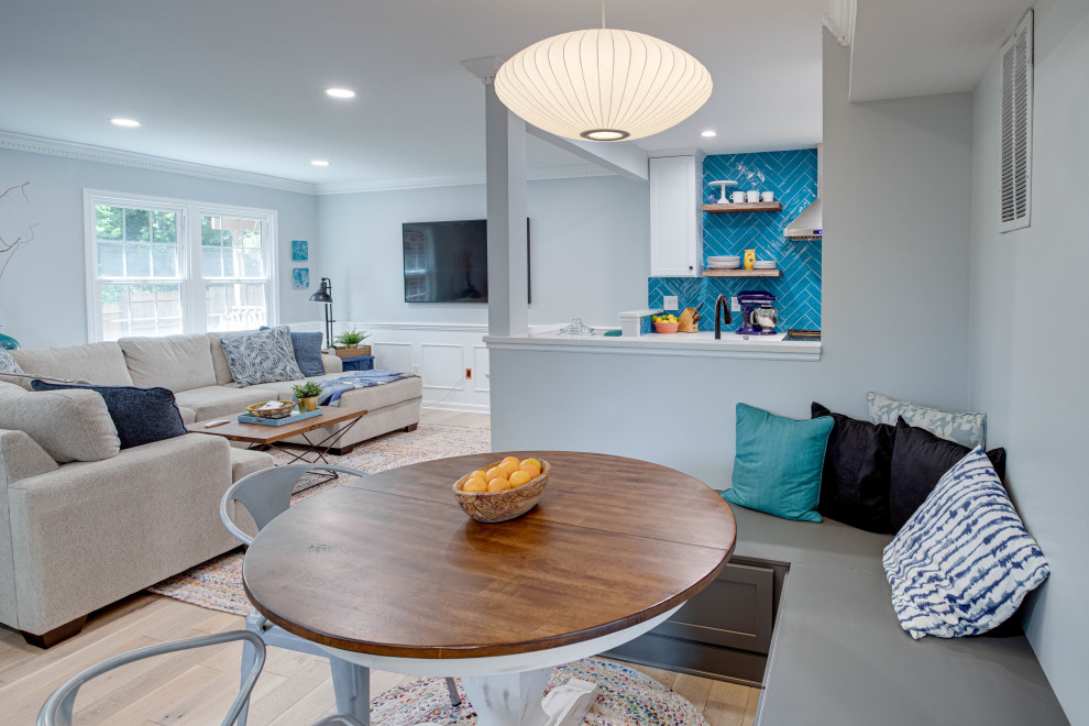 Inspiration for a mid-sized transitional galley kitchen remodel in DC Metro with an undermount sink, shaker cabinets, quartz countertops, blue backsplash, stainless steel appliances and no island