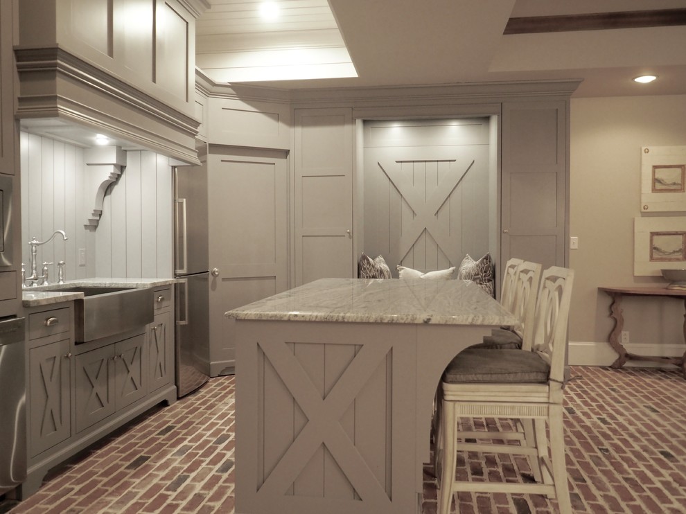 Inspiration for a mid-sized country l-shaped eat-in kitchen in Atlanta with a farmhouse sink, shaker cabinets, grey cabinets, granite benchtops, stainless steel appliances, brick floors, with island, red floor, grey benchtop, white splashback and timber splashback.