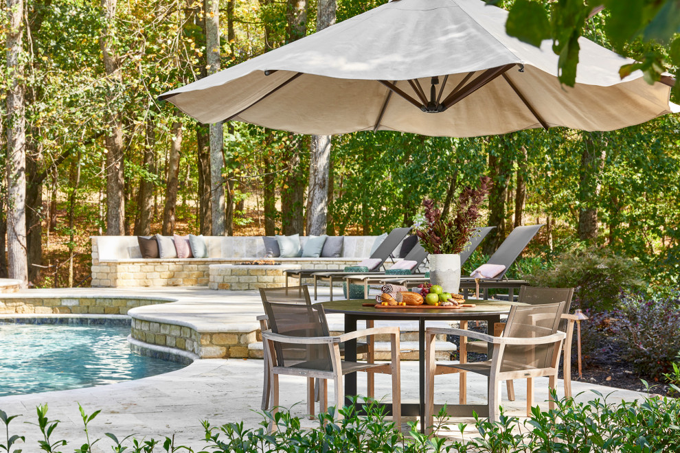 Inspiration for an expansive traditional backyard patio in Atlanta with a fire feature and natural stone pavers.