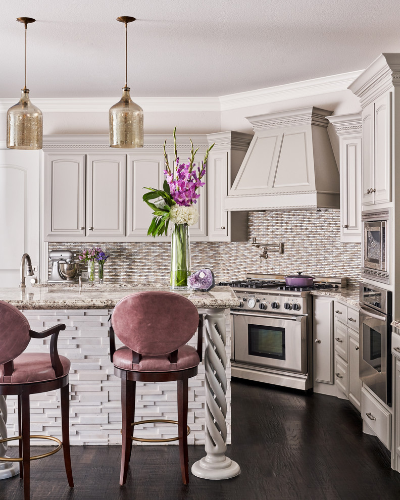Transitional l-shaped dark wood floor kitchen photo with raised-panel cabinets, gray cabinets, multicolored backsplash, mosaic tile backsplash, stainless steel appliances, an island and multicolored countertops