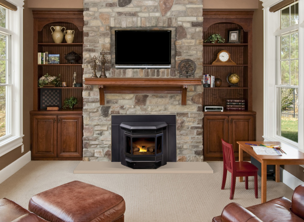 Inspiration for a mid-sized arts and crafts enclosed living room in Seattle with brown walls, carpet, a standard fireplace, a stone fireplace surround, a wall-mounted tv and beige floor.