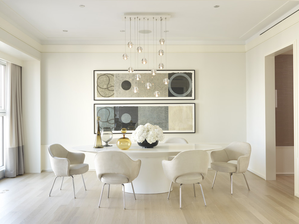 Photo of a mid-sized contemporary separate dining room in Other with white walls, light hardwood floors and beige floor.