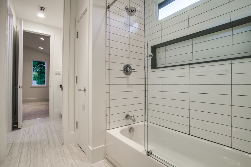 Design ideas for a large modern bathroom in Dallas with an undermount sink, flat-panel cabinets, white cabinets, engineered quartz benchtops, an alcove tub, a shower/bathtub combo, a two-piece toilet, white tile, porcelain tile, white walls and porcelain floors.