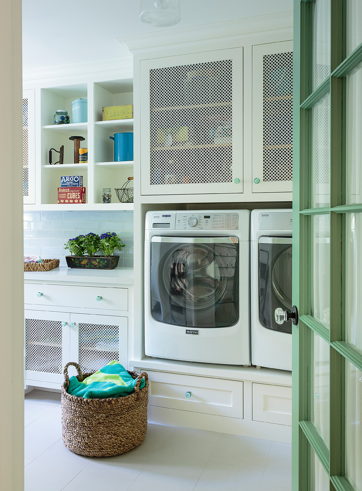 Design ideas for a large beach style single-wall dedicated laundry room in Los Angeles with shaker cabinets, white cabinets, quartz benchtops, porcelain floors, a side-by-side washer and dryer, white benchtop and white floor.