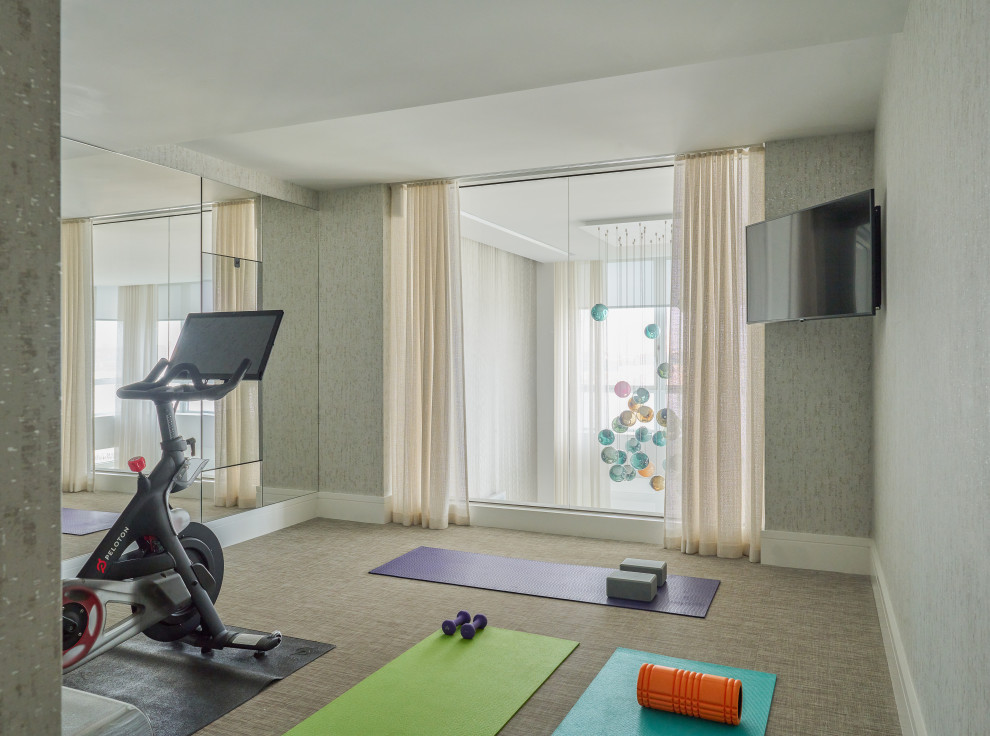 Photo of a contemporary home gym in New York.