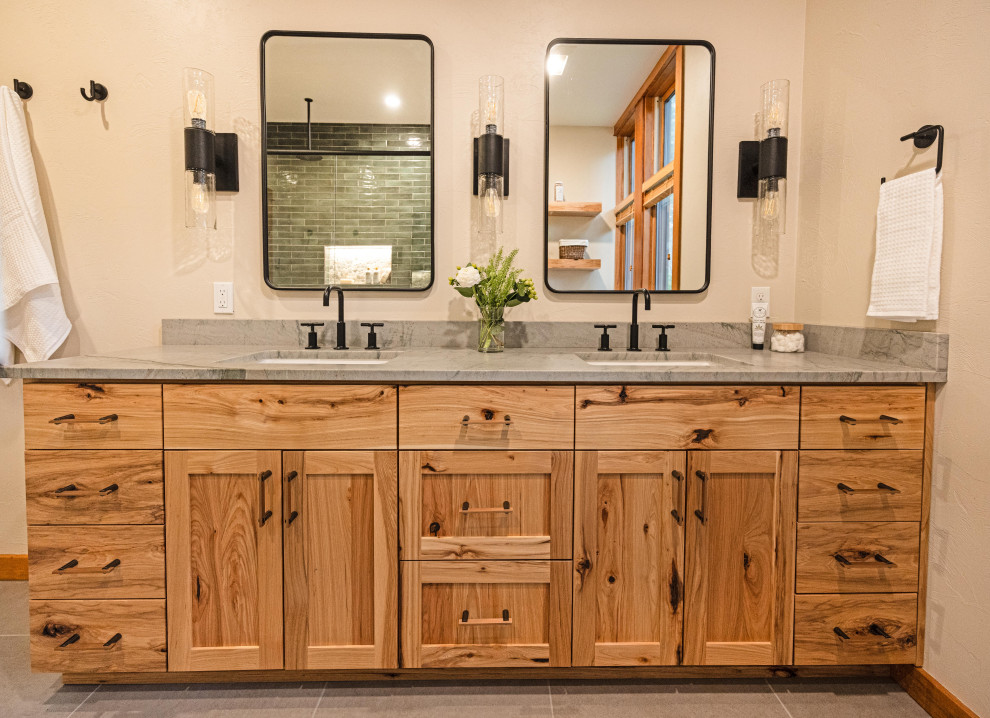 Inspiration for a large rustic master multicolored tile and ceramic tile porcelain tile, gray floor and double-sink doorless shower remodel with shaker cabinets, medium tone wood cabinets, a one-piece toilet, beige walls, an undermount sink, quartzite countertops, a hinged shower door, gray countertops, a niche and a floating vanity